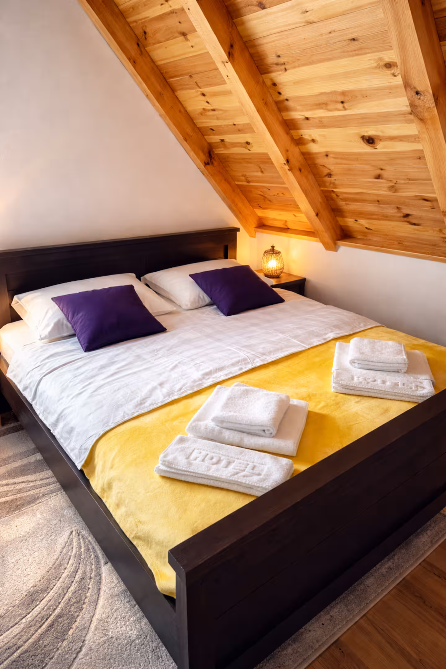 Bedroom under wooden attic beams